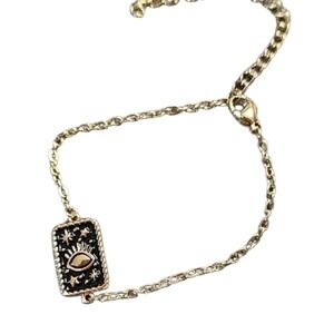 Goldtone and Black Eye Charm Bracelet